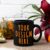 Black Coffee Mug Mockup with Pumpkin and Red Lily