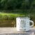 White Campfire Enamel Mug Mockup River View.