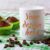 White Mug Mockup with Chocolate Muffins on Green Checkered Napkin
