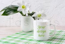 White Mug Mockup with Lily in Vase on Green Checkered Napkin Poster 1