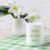 White Mug Mockup with Lily in Vase on Green Checkered Napkin