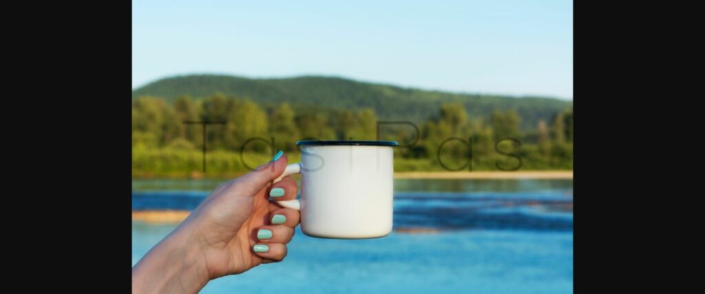 Woman Holding Enamel Mug with River View Poster 5